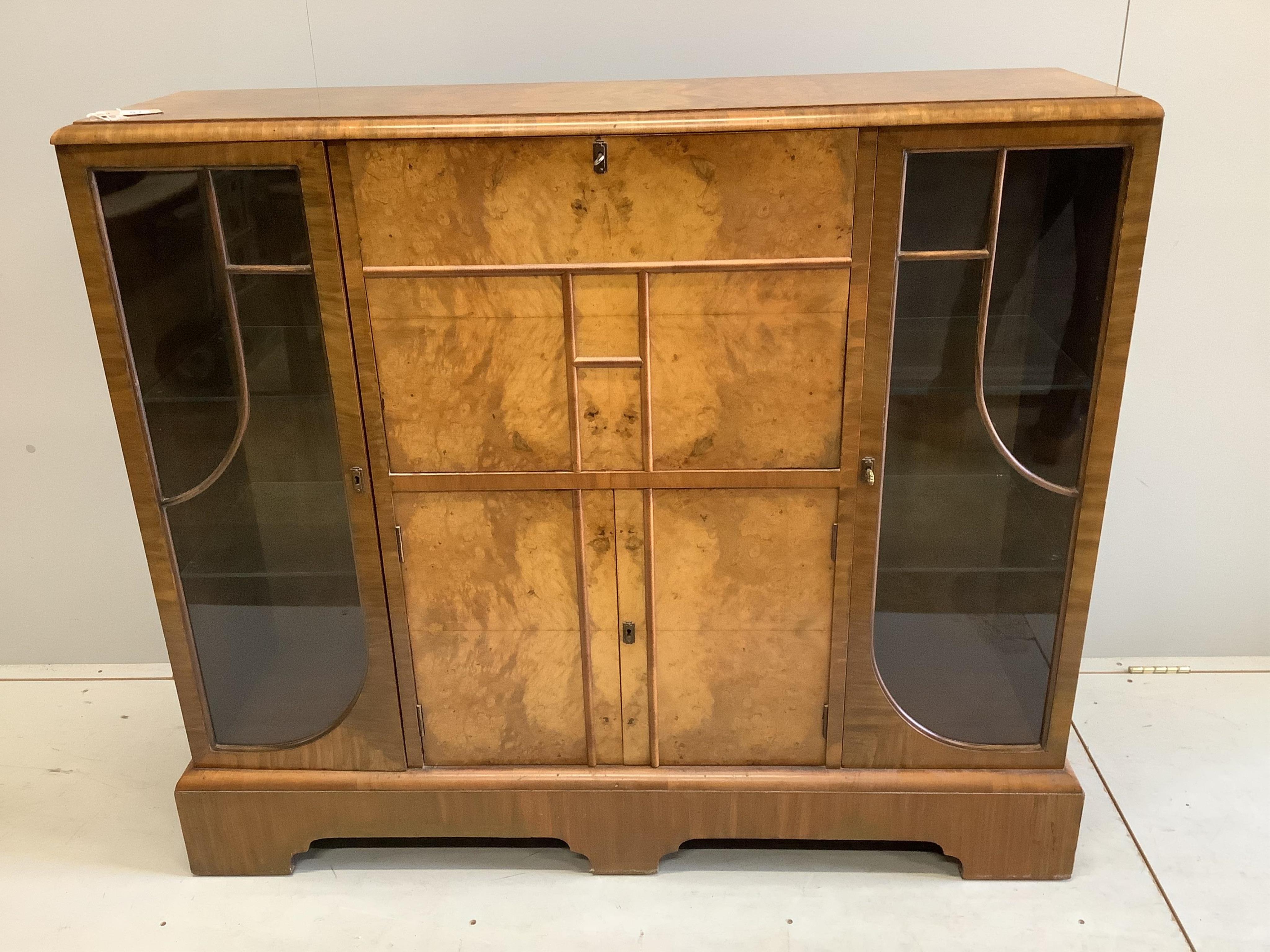 An early 20th century Art Deco style burr walnut secretaire cabinet, width 122cm, depth 34cm, height 107cm. Condition - fair to good.